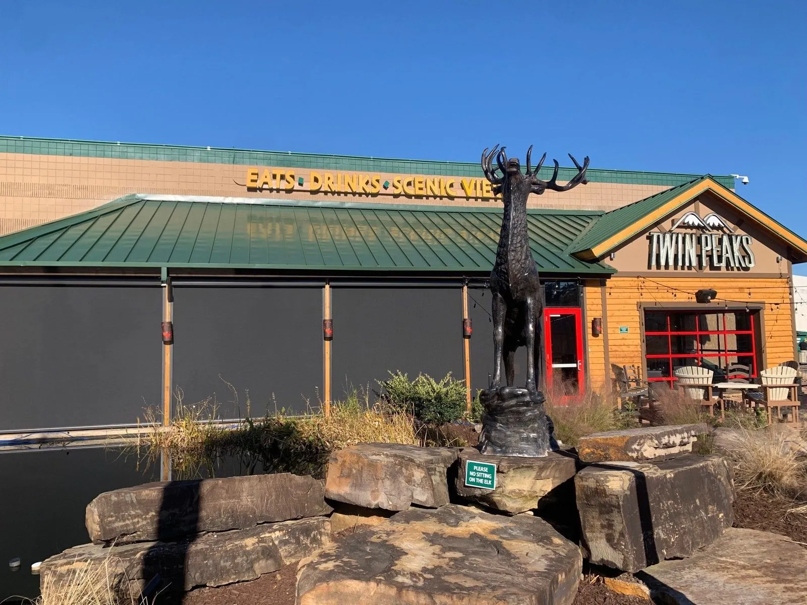 Solar screens across the full patio elevation of a Twin Peaks restaurant