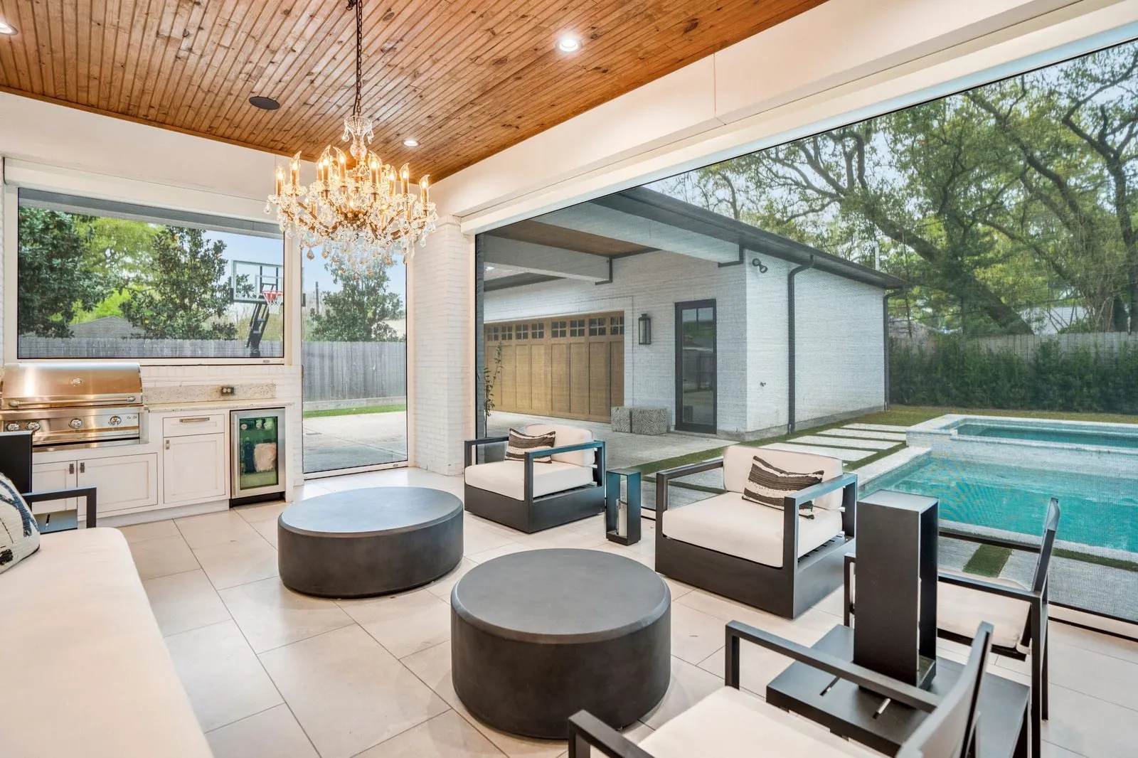 Screened outdoor living room controlled by app and remote