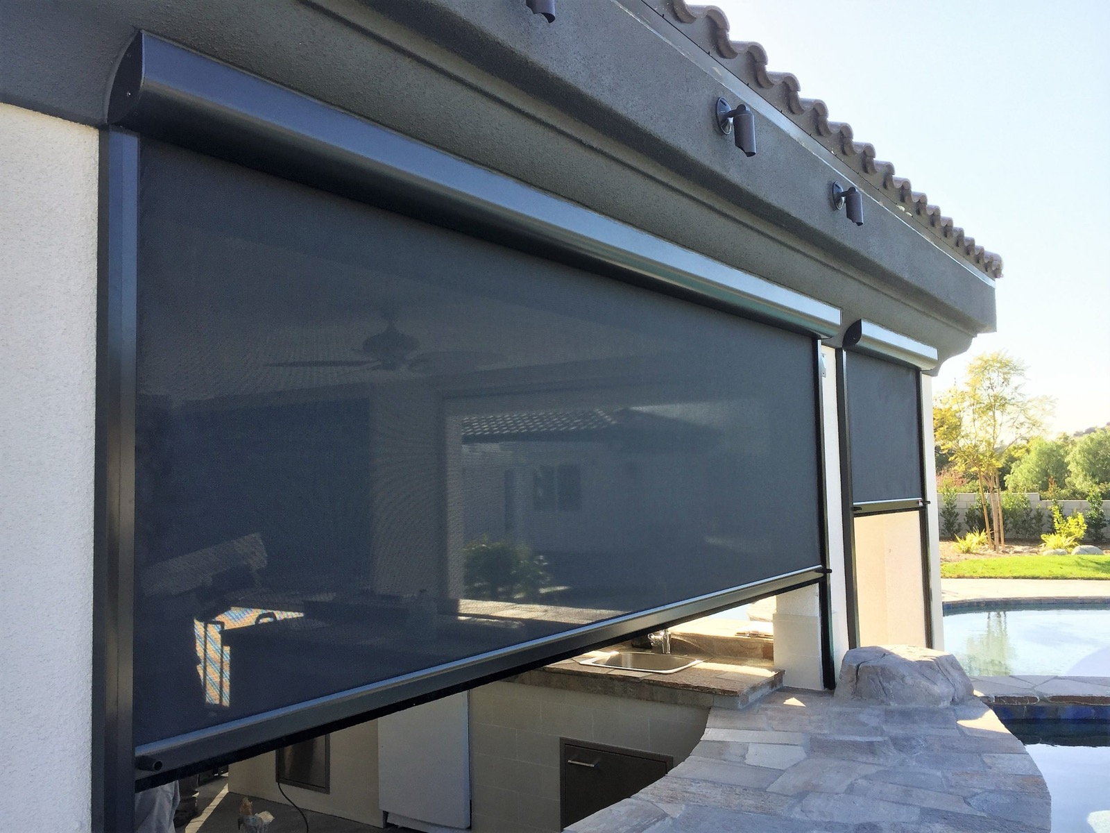 Close detail of a MagnaTrack aluminum side track and screen edge